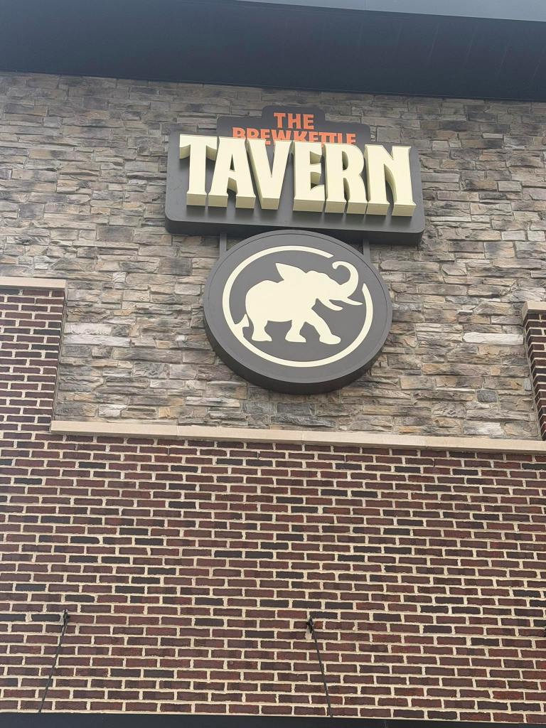 building looking up at tbk tavern logo.jpg